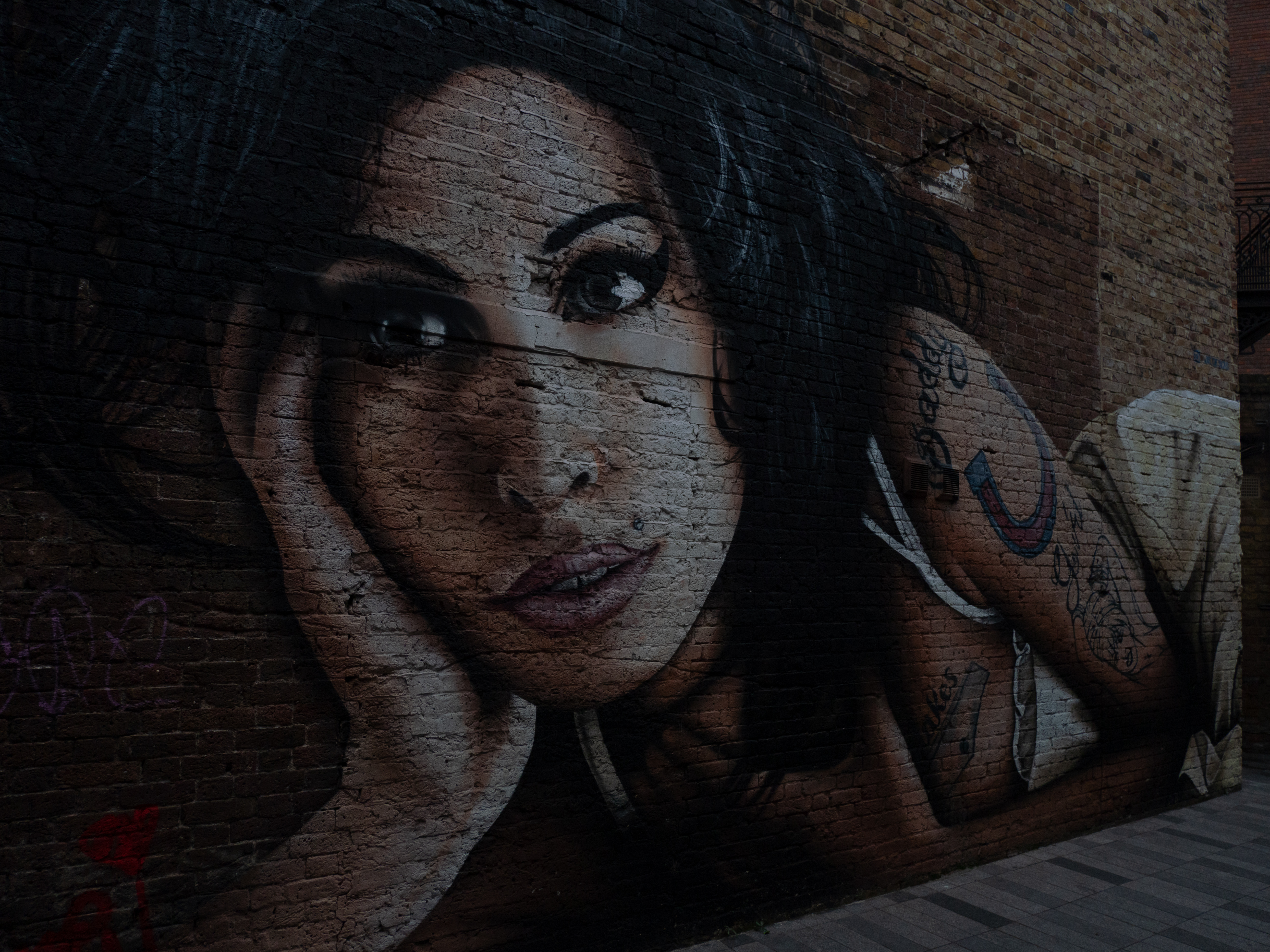 Painting of Amy Winehouse in Camden Market in London